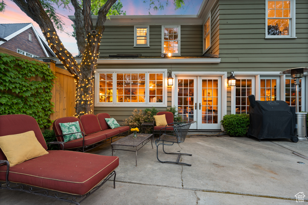 View of patio featuring french doors, a grill, and an outdoor hangout area