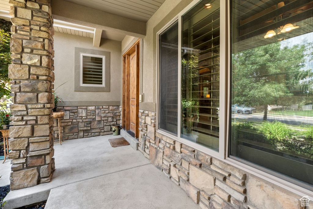 Property entrance featuring stone siding