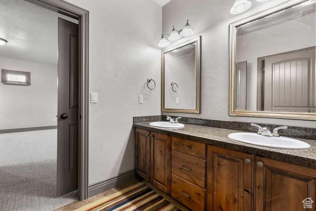 Full bathroom featuring double vanity