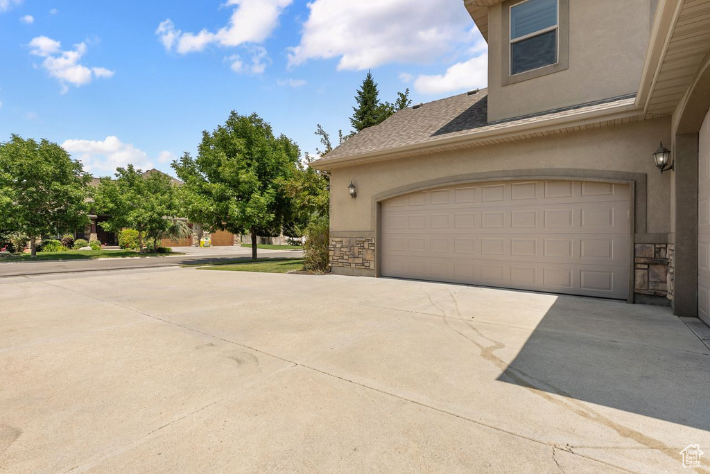 Garage featuring driveway