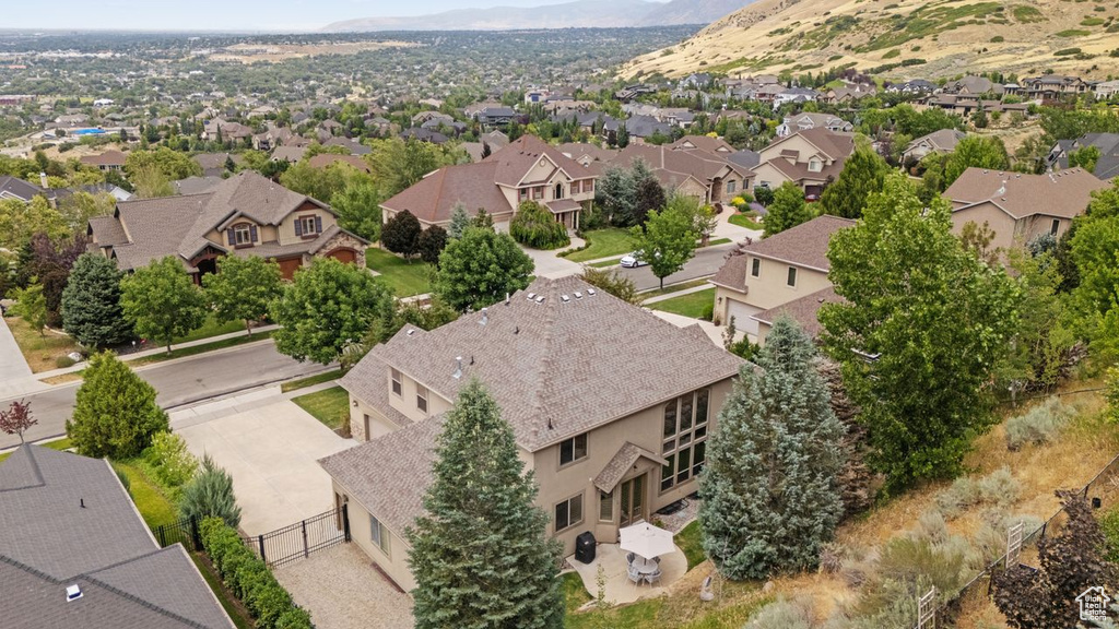 Aerial perspective of suburban area featuring a mountain backdrop