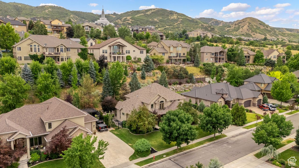 Aerial perspective of suburban area with a mountain backdrop