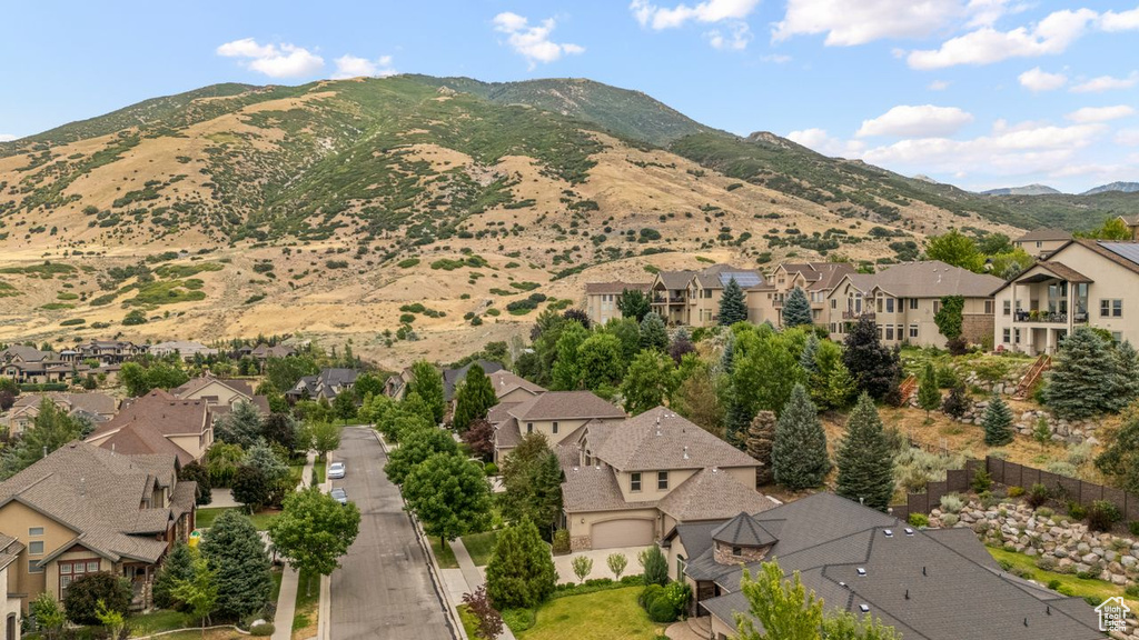 View of mountain backdrop featuring nearby suburban area