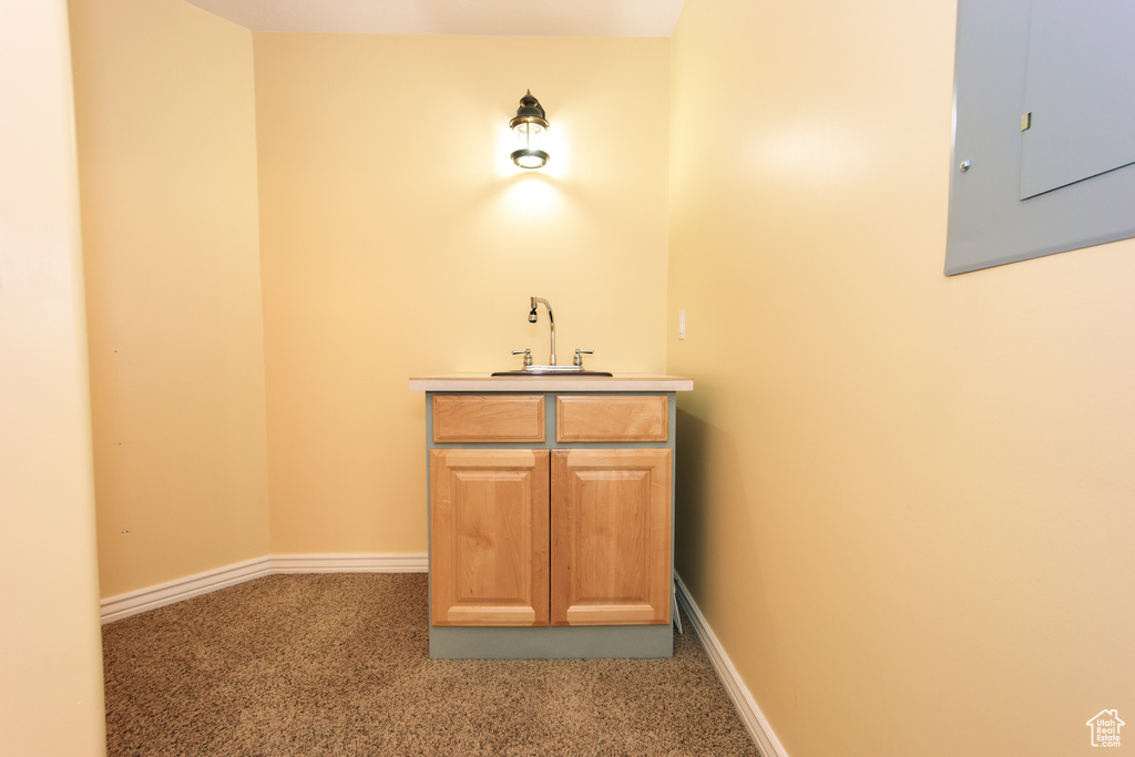 Bar featuring carpet floors and electric panel