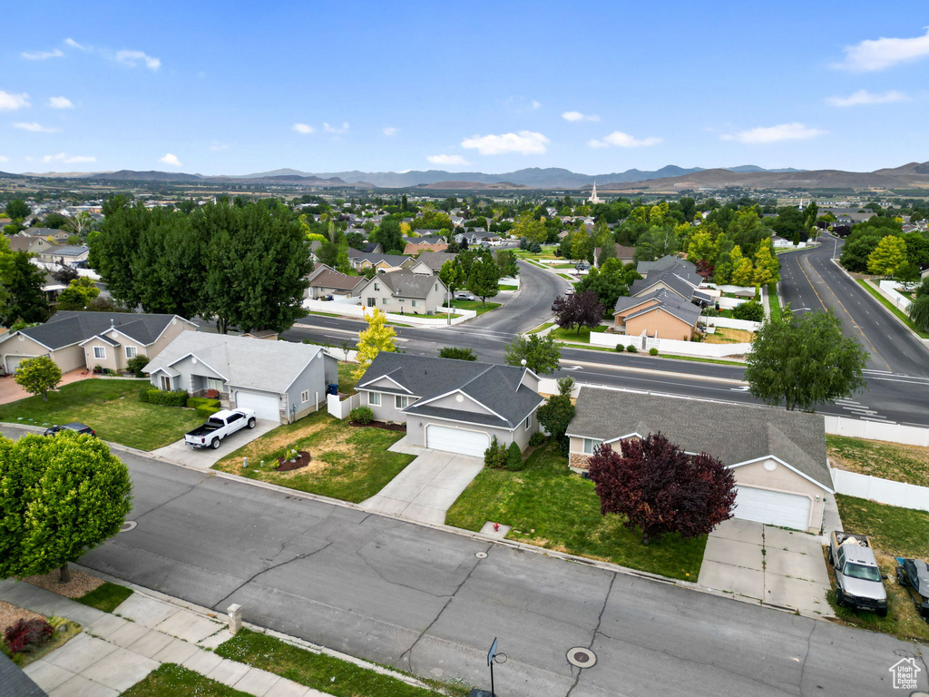 Aerial perspective of suburban area featuring a mountain backdrop