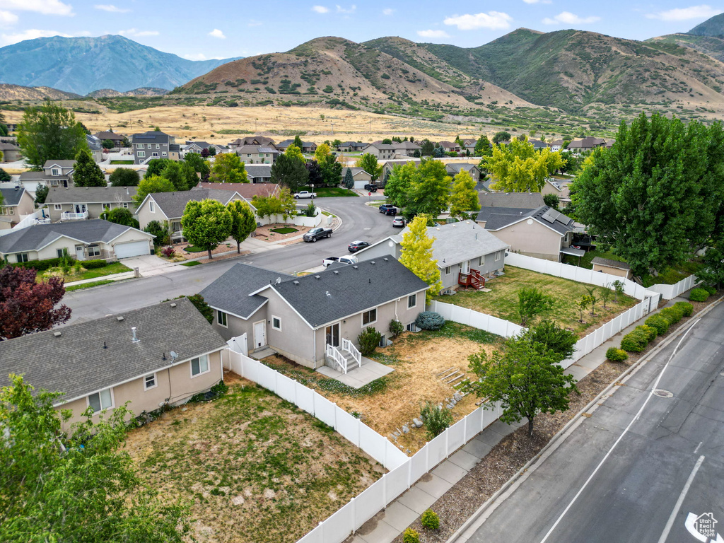 Aerial view of residential area with a mountain backdrop