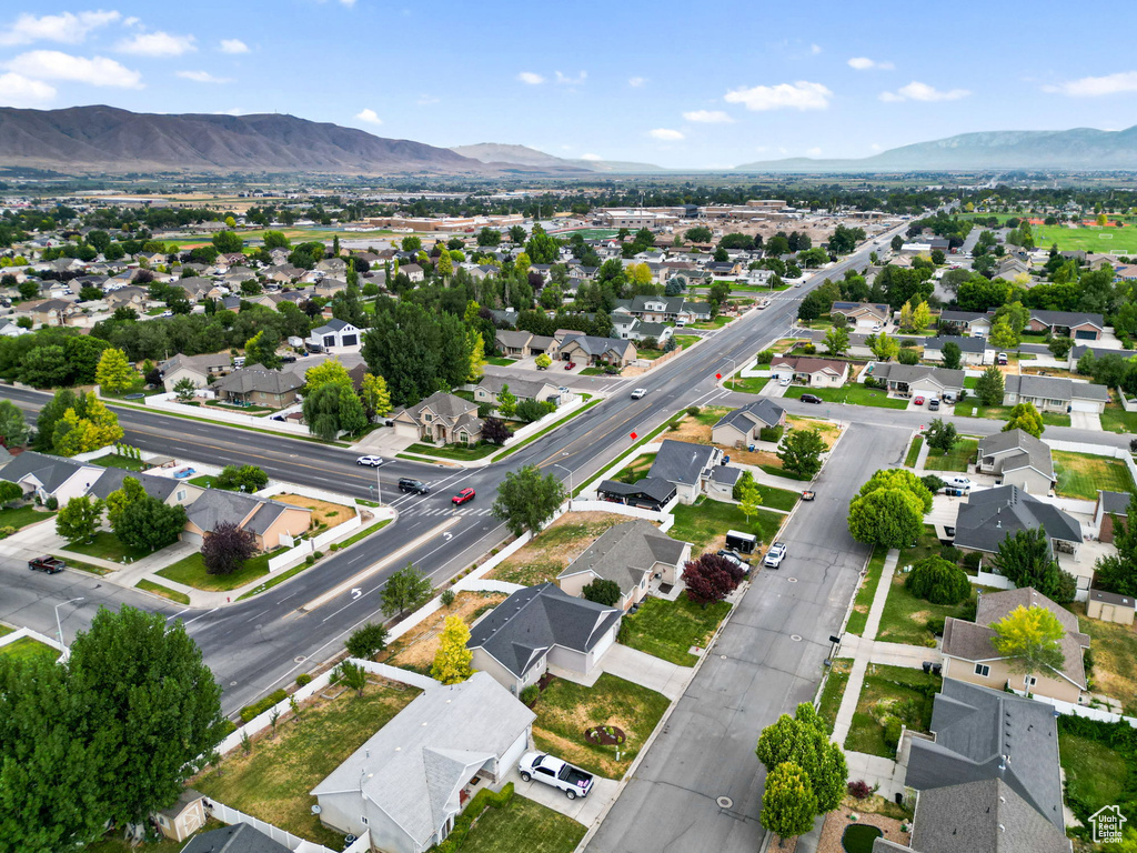 View of property location with mountains and nearby suburban area
