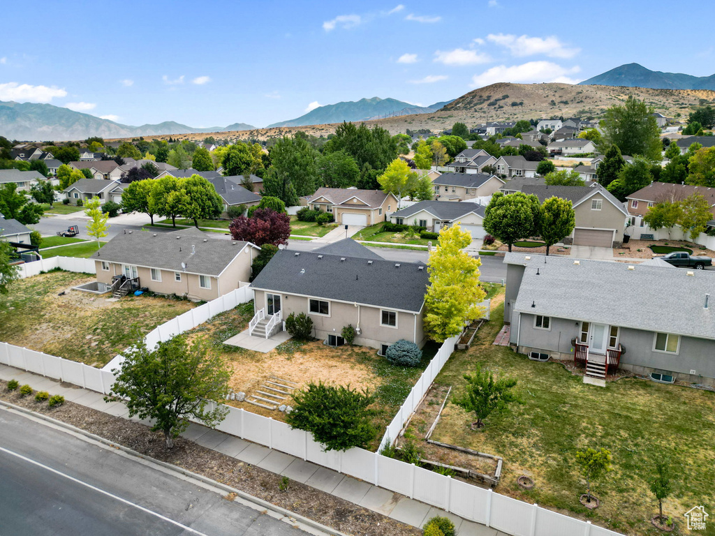Aerial view of residential area with a mountain backdrop