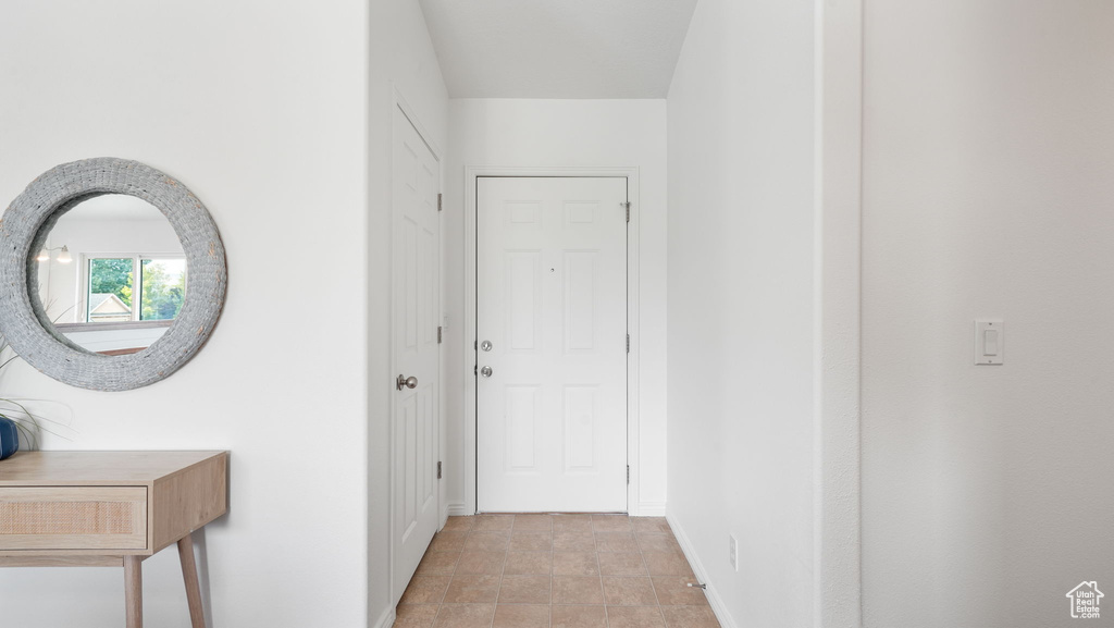 Corridor with baseboards and stone finish flooring