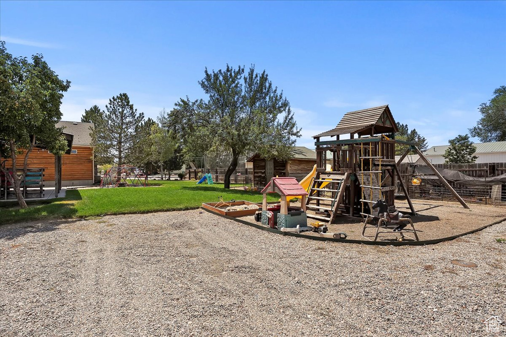 View of playground featuring a yard
