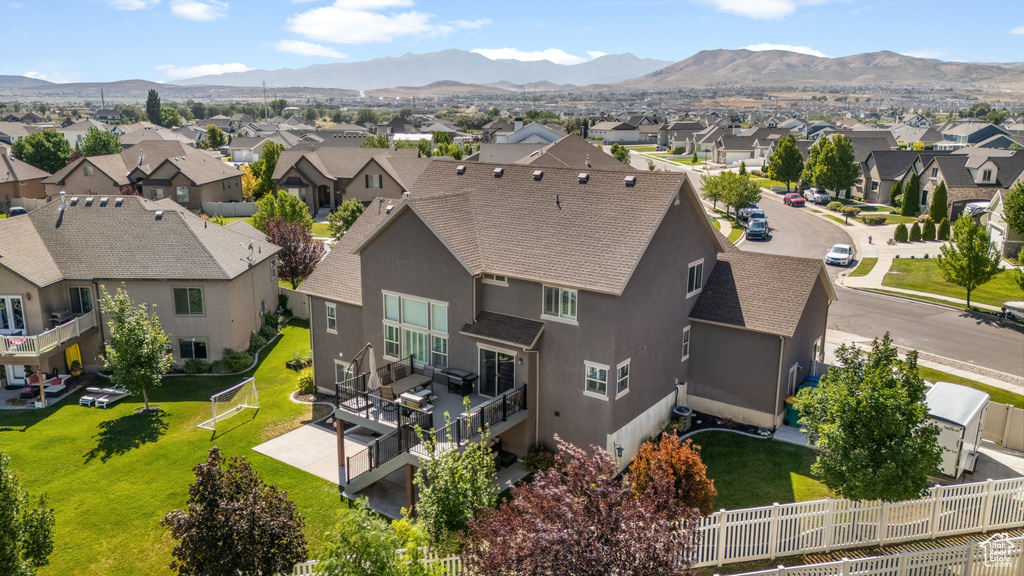 Aerial view of residential area with a mountainous background