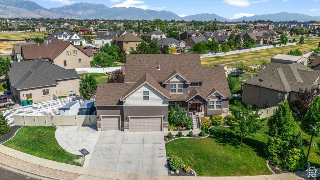 Aerial view of residential area featuring mountains