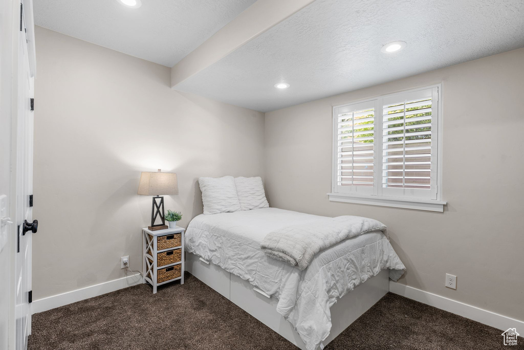 Carpeted bedroom featuring baseboards and recessed lighting