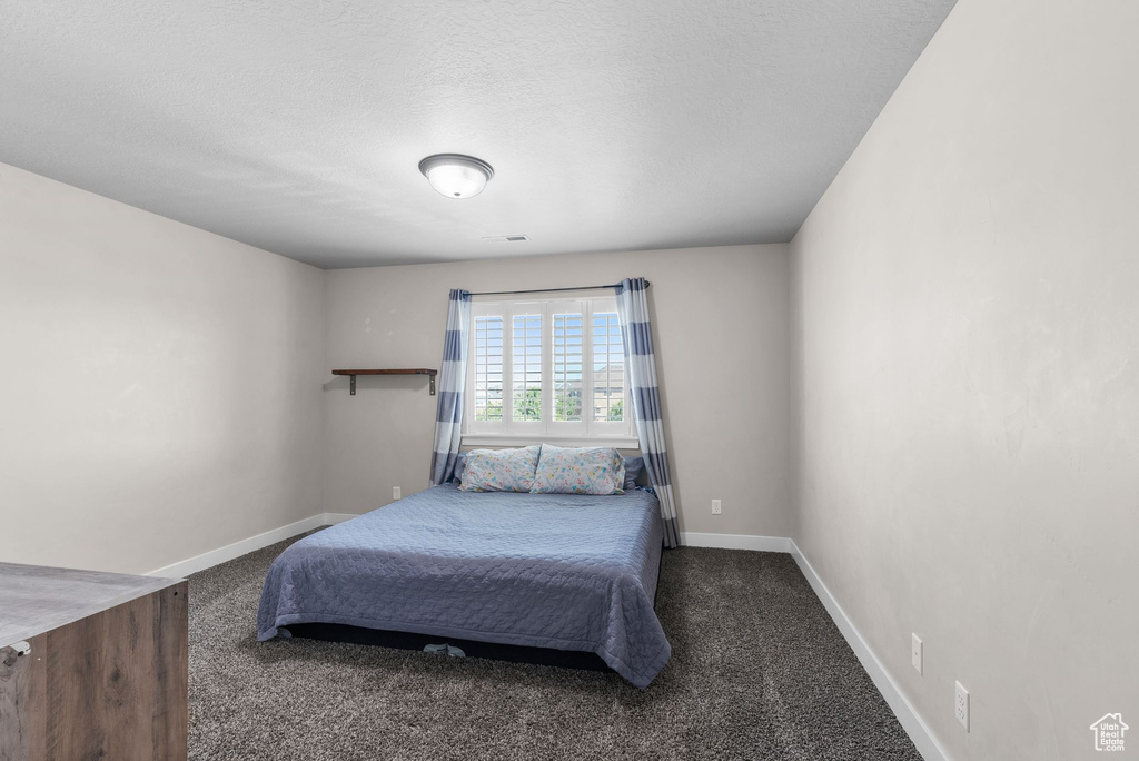 Bedroom with carpet flooring
