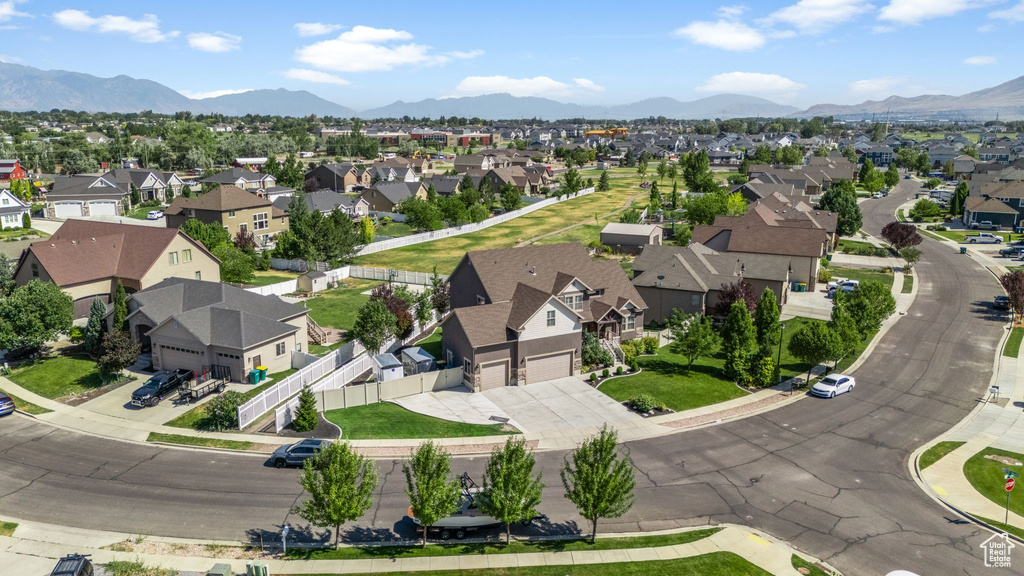 Aerial view of residential area featuring mountains