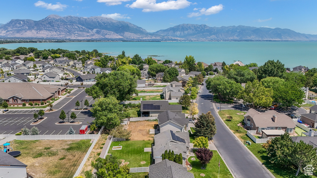 Aerial perspective of suburban area with a water and mountain view