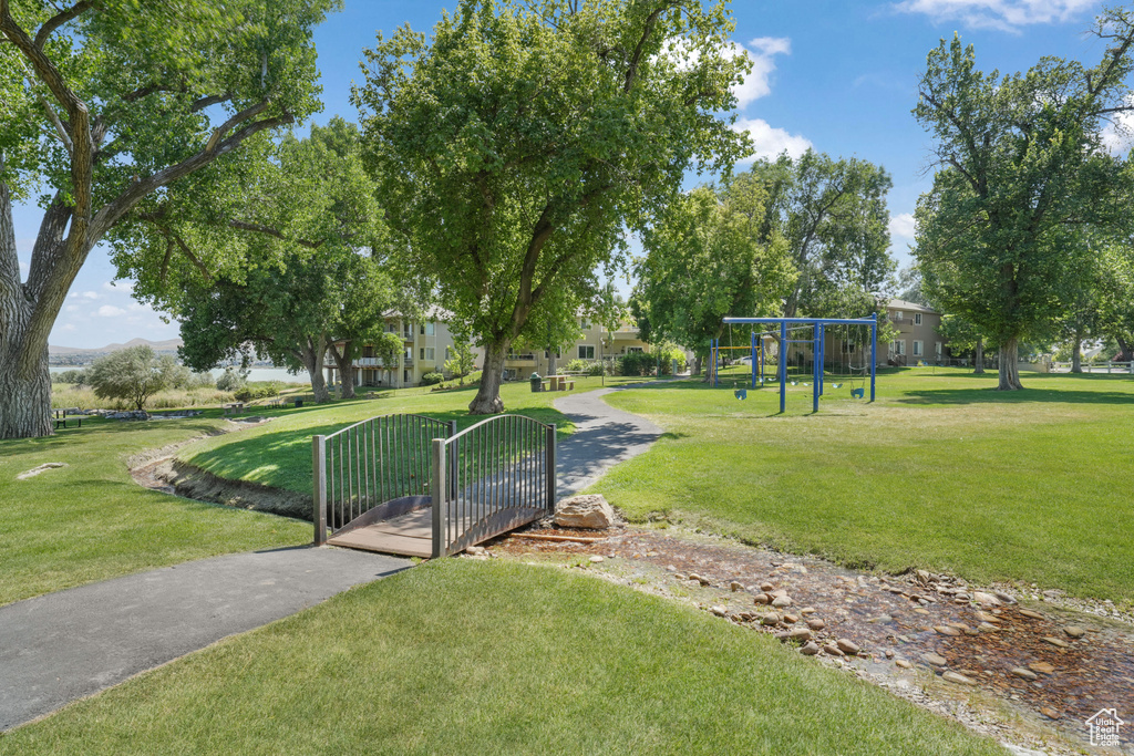 View of property's community with a yard