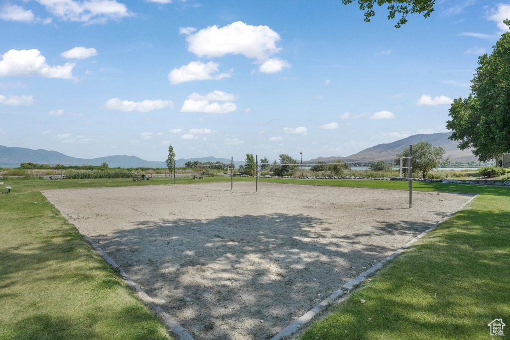 Surrounding community with a mountain view, volleyball court, and a view of rural / pastoral area