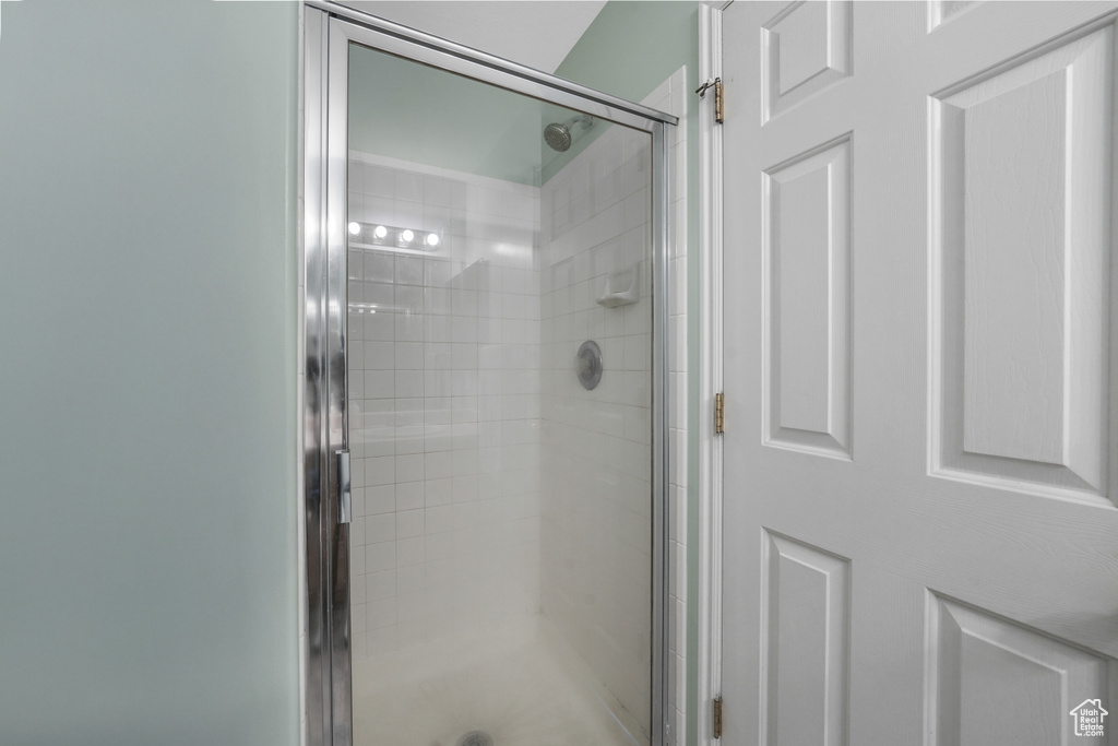 Bathroom featuring a shower stall