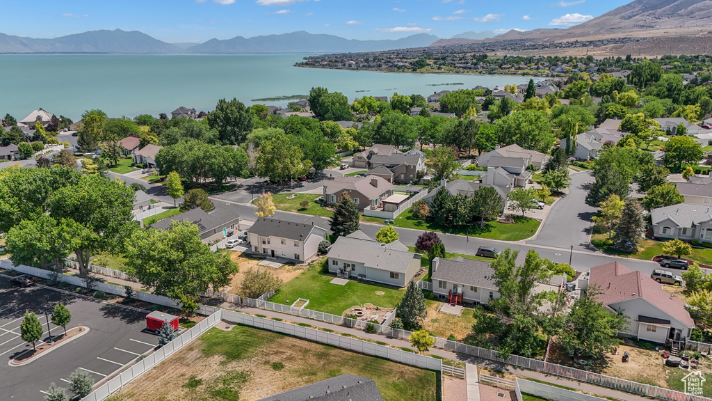 Aerial perspective of suburban area with a water and mountain view