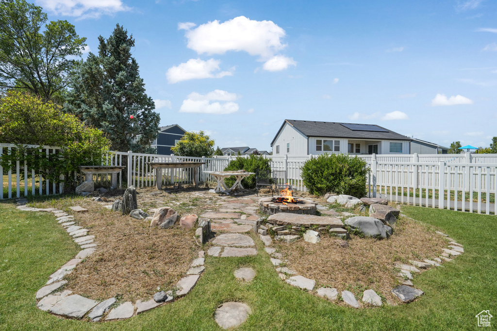 View of yard featuring a fire pit