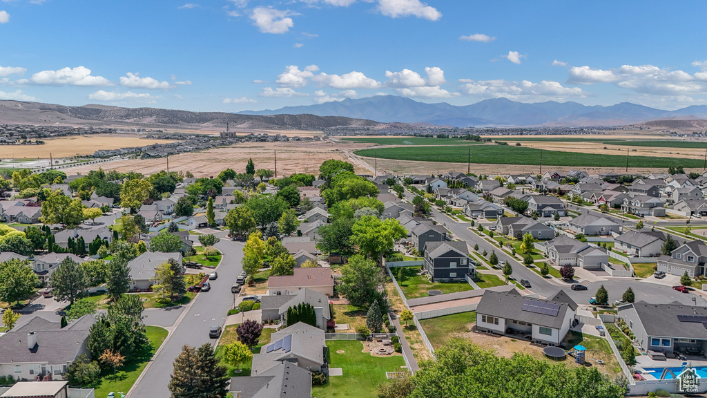 Aerial perspective of suburban area with a mountain backdrop