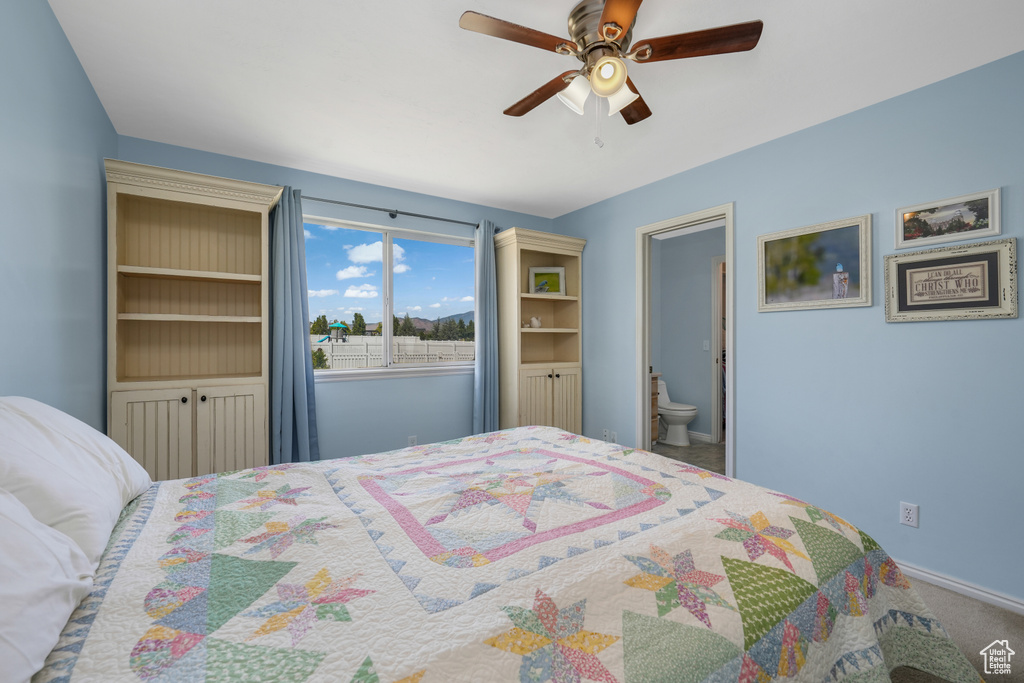 Bedroom with carpet flooring, ceiling fan, and connected bathroom
