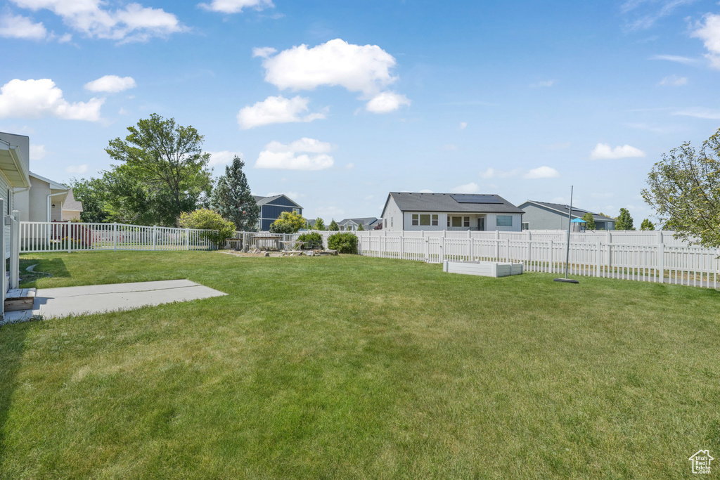 Fenced backyard with a residential view