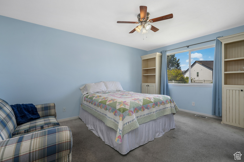 Bedroom featuring carpet floors and ceiling fan