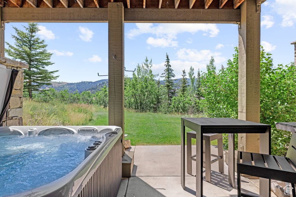 View of patio / terrace featuring a hot tub