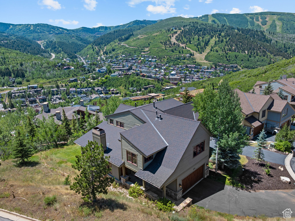Aerial perspective of suburban area featuring a mountain backdrop
