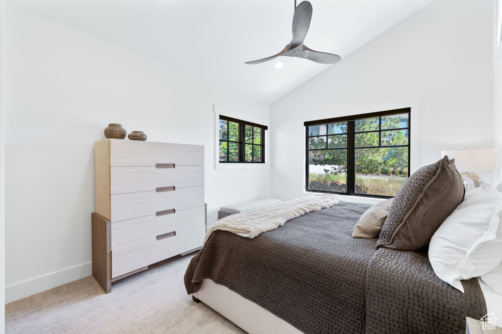 Bedroom featuring lofted ceiling, light carpet, a ceiling fan, and recessed lighting