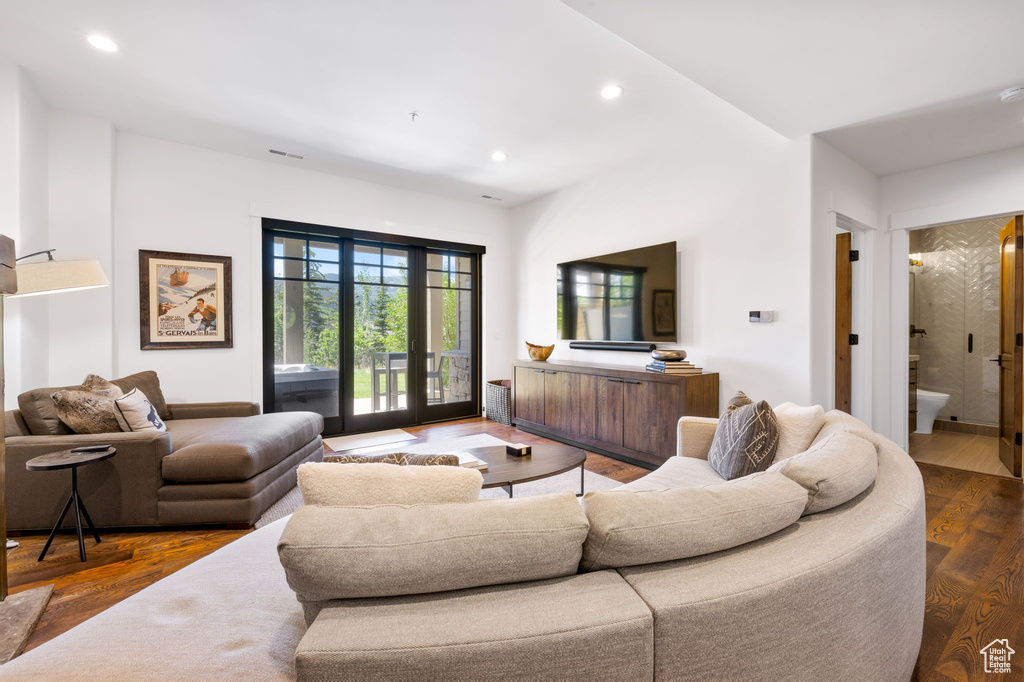 Living area featuring recessed lighting and dark wood finished floors