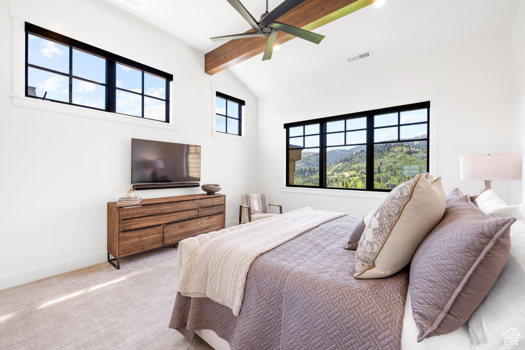 Bedroom with beamed ceiling, high vaulted ceiling, carpet floors, and a ceiling fan
