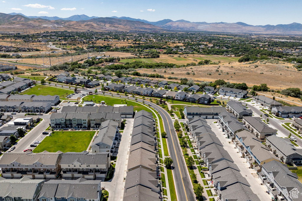 Aerial perspective of suburban area with a mountainous background