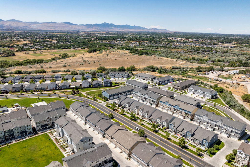 Aerial view of residential area featuring a mountain backdrop