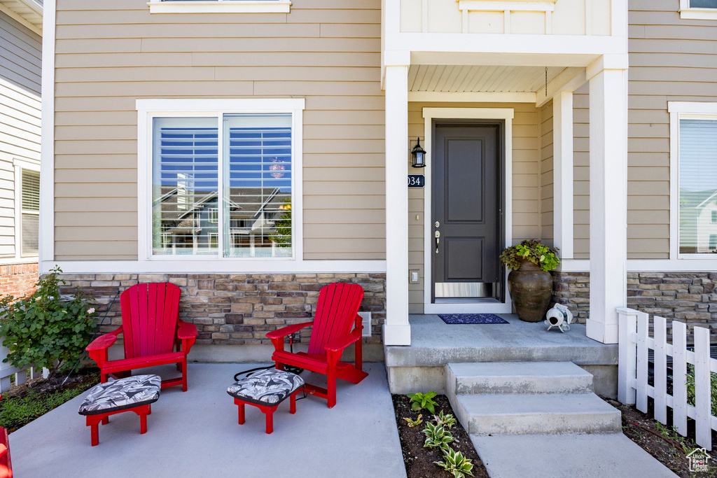 View of exterior entry featuring stone siding