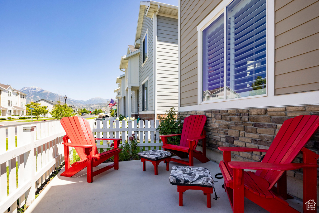 View of patio / terrace with a mountain view and a residential view