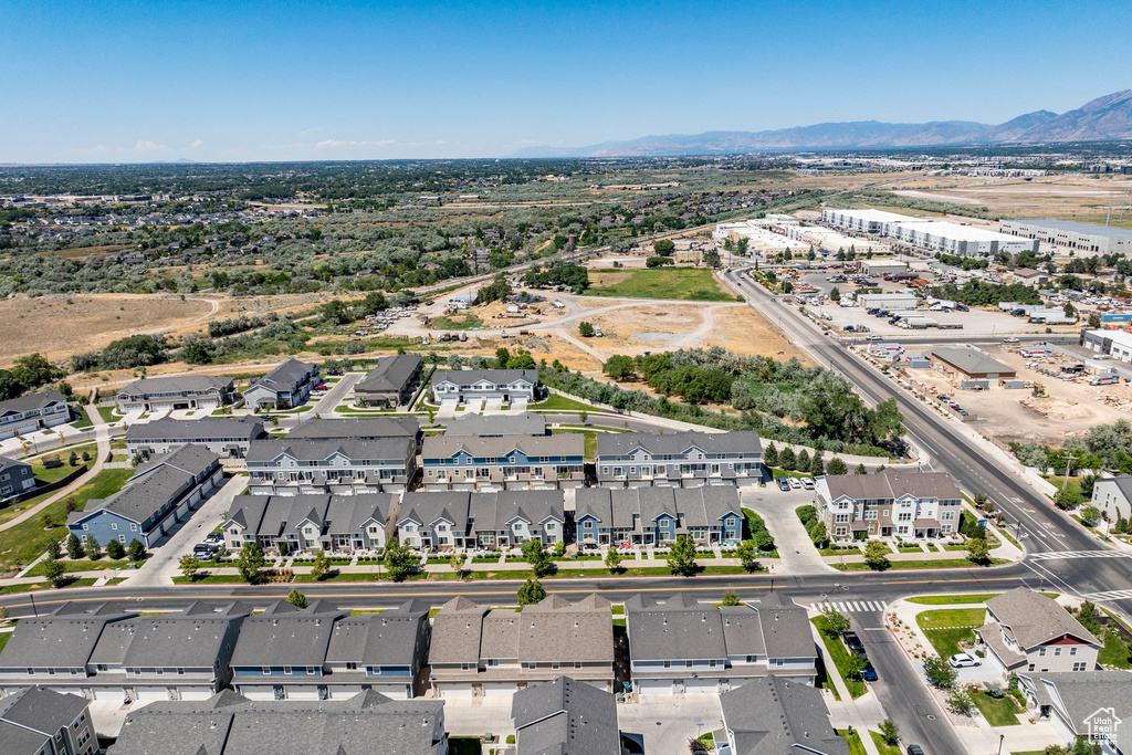 Aerial perspective of suburban area with a mountain backdrop