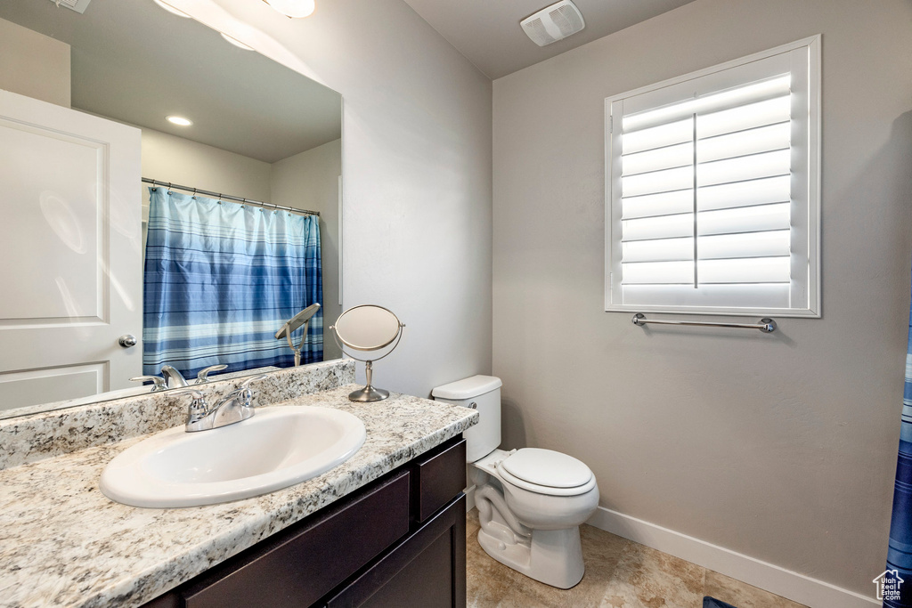Bathroom with vanity and toilet