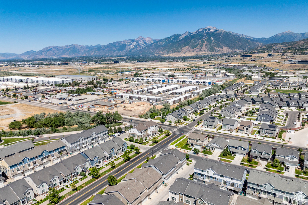 Aerial perspective of suburban area with a mountainous background