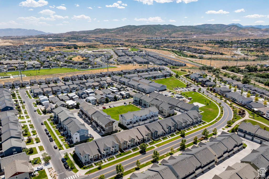 Aerial view of residential area featuring a mountain backdrop