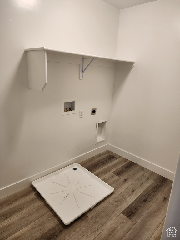 Laundry room featuring hookup for a washing machine, wood finished floors, and hookup for an electric dryer