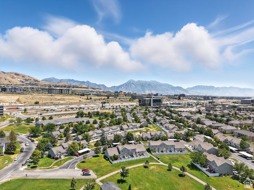 Aerial perspective of suburban area with a mountainous background