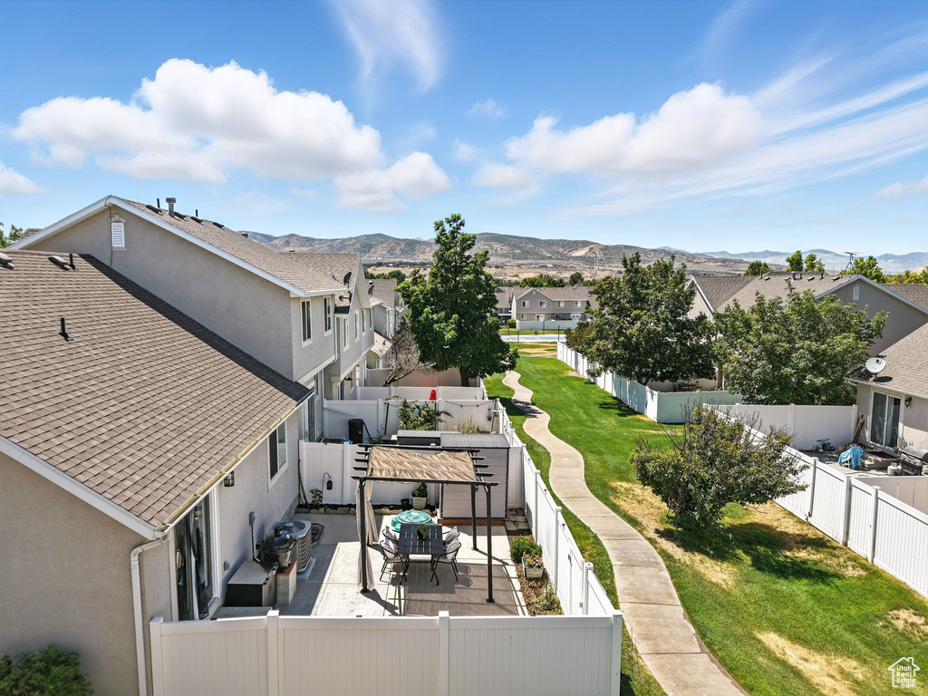 Aerial view of residential area featuring a mountainous background