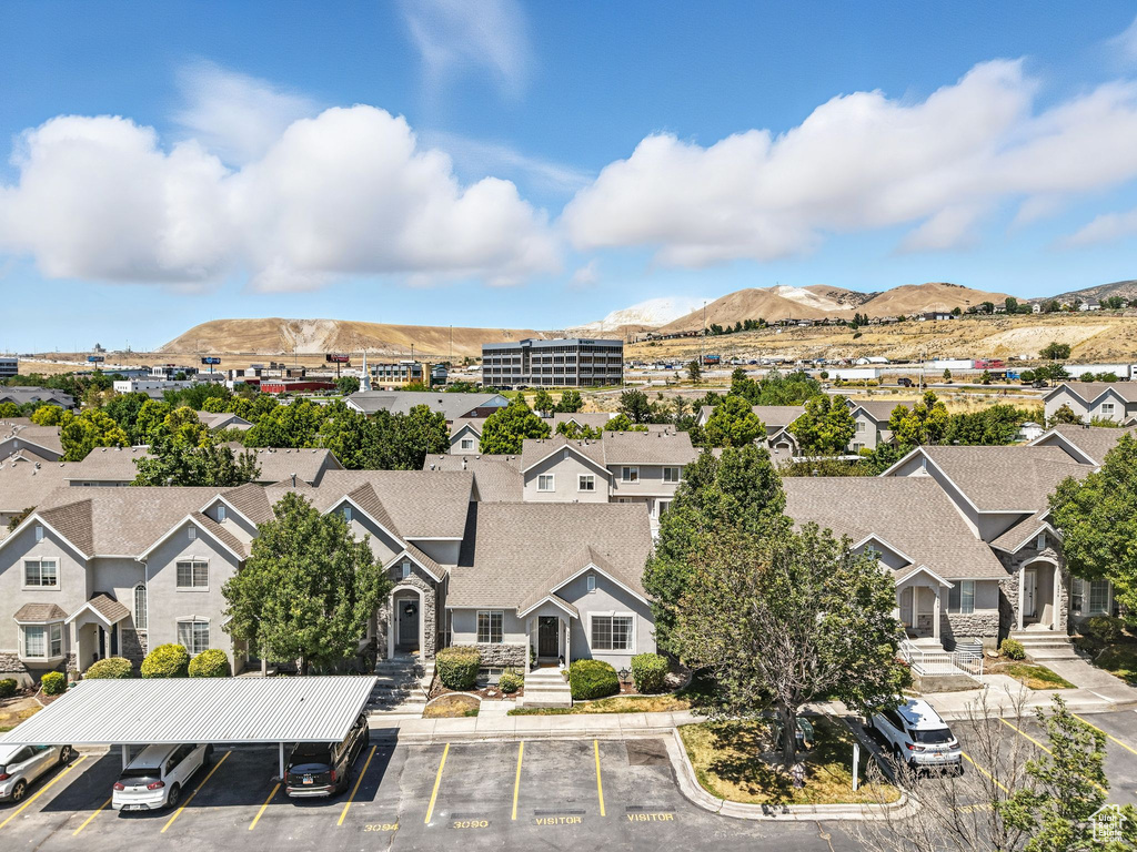 Aerial view of residential area featuring mountains