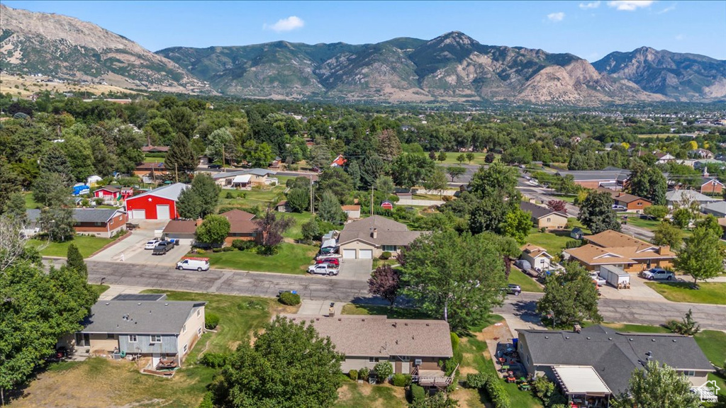 Aerial view of residential area featuring a mountain backdrop