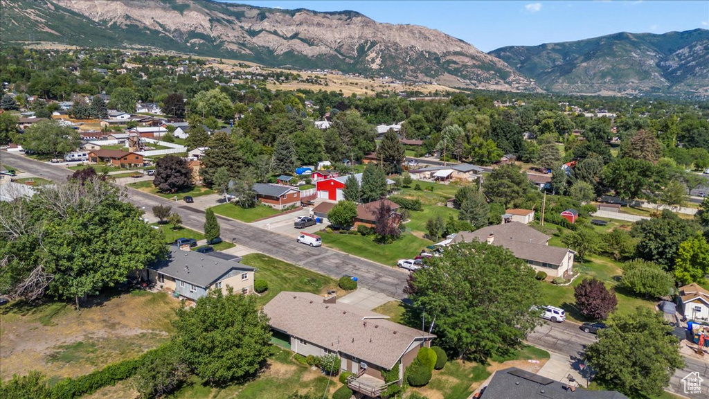 Aerial view of residential area featuring a mountain backdrop