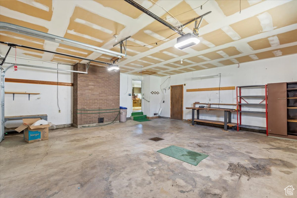 Garage featuring a garage door opener