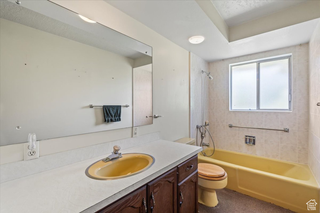 Full bath featuring vanity and shower / tub combination